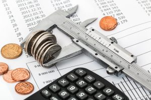 Calhoun County Credit Card Debt Settlement Canva Coins and Calculator on a Invoice 300x200