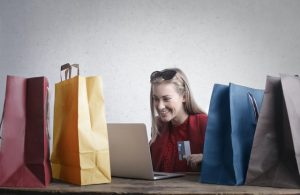 Dunedin Credit Card Debt Settlement happy woman shopping online at home 3769747 300x195